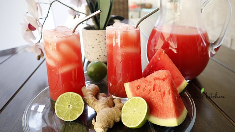 Glass of watermelon lime ginger juice with fresh watermelon slices, lime wedges, and ginger, perfect for rehydration and blood sugar stability after intense CrossFit workouts.