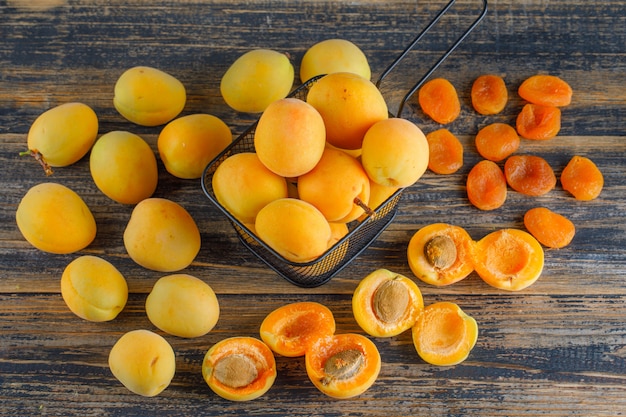 Are apricots good to eat with diabetes? Fresh apricots on a wooden table, showcasing a diabetes-friendly fruit option rich in fiber and antioxidants.