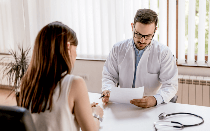 Interpreting raised serum ferritin levels: Doctor reviewing blood test results to interpret high ferritin levels using iron studies and related diagnostic tests.