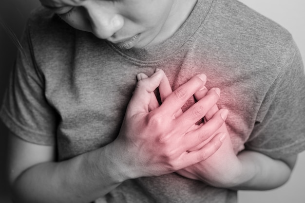 Woman experiencing fatigue and jaw discomfort, early heart attack symptoms in women.