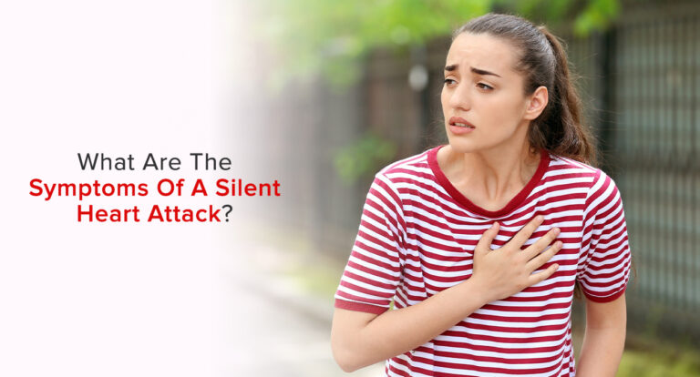 Woman in a red striped shirt pressing her hand to her chest, showing a possible heart attack with no symptoms.